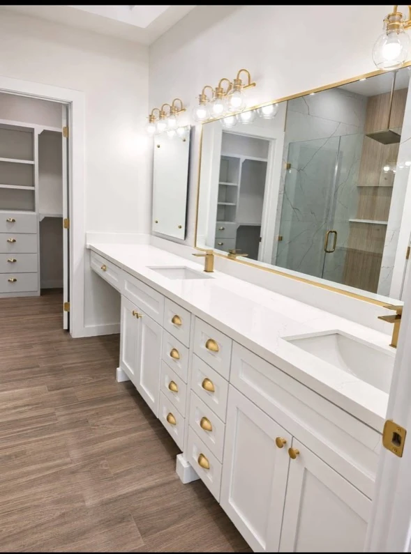 Double vanity and shower in a remodeled bathroom.